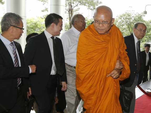 Suthep Thaugsuban, a former deputy prime minister who ordered a bloody crackdown on protesters in 2010 and later encouraged a coup against the elected government, arrives at court on Thursday. In recent weeks, Suthep has become a Buddhist monk.