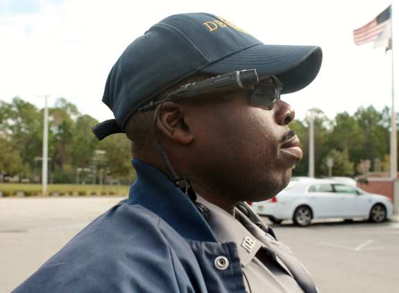 Jermaine Jones, a patrol officer with the Daytona Police Department, wears a body camera to record his interactions with the public.. Photo: Renata Sago, WMFE.