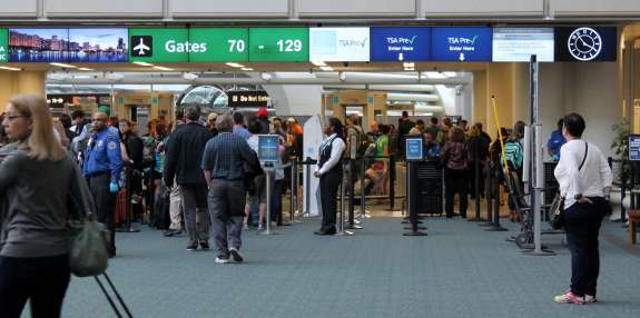 The Greater Orlando Aviation Authority voted Wednesday at its board meeting to keep federal screeners and submit them to a quarterly review. Photo: Renata Sago.