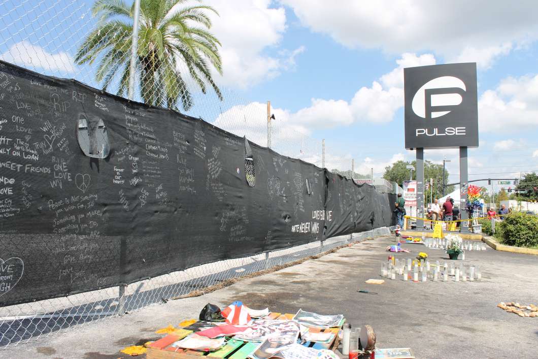 The privacy screen on the old fence is also being removed for storage by the Orange County Regional History Center. Photo: Matthew Peddie, WMFE