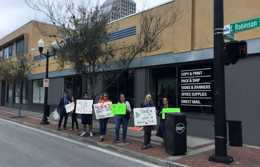 Gun reform advocates in Orlando say FedEx is helping the National Rifle Association grow its membership. Photo: WMFE.