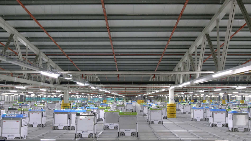 Photo of a prototype customer fulfillment center populated by by robotic equipment courtesy of Kroger, Ocado, and Lake County government