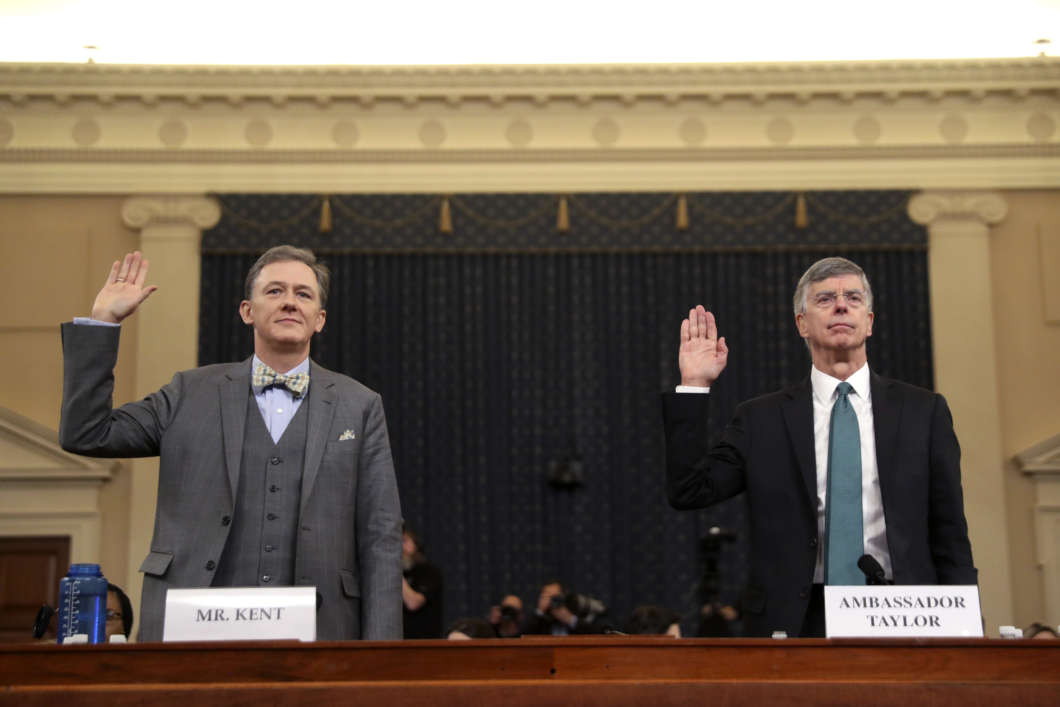 Top State Department official George Kent (left) and acting U.S. Ambassador to Ukraine William Taylor are sworn in to testify during the first public Trump impeachment hearing on Wednesday.