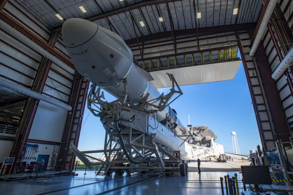 A SpaceX Falcon 9 rocket, topped with the upgraded version of the Cargo Dragon spacecraft, is seen inside the company’s hangar at NASA’s Kennedy Space Center in Florida on Dec. 2, 2020, prior to being rolled out to the launch pad in preparation for the 21st Commercial Resupply Services (CRS-21) launch. Photo: NASA